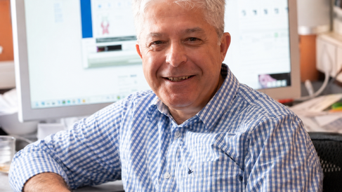 image of Professor Koronakis at his desk in the lab