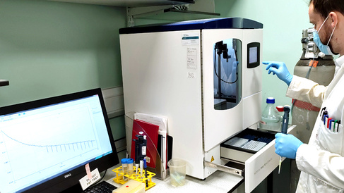 Technician operating Biomedical Isothermal Titration Calorimetry Facility