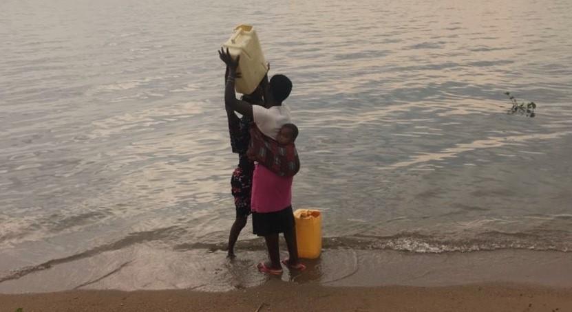 Woman with children in water